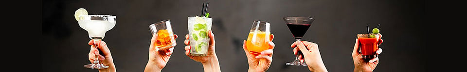 Hands holding cocktails